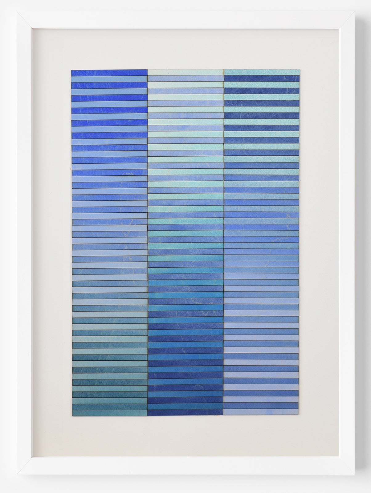 Blue abstract artwork by Amelia Coward, 3d horizontal stripes cut from birchwood panel paintings