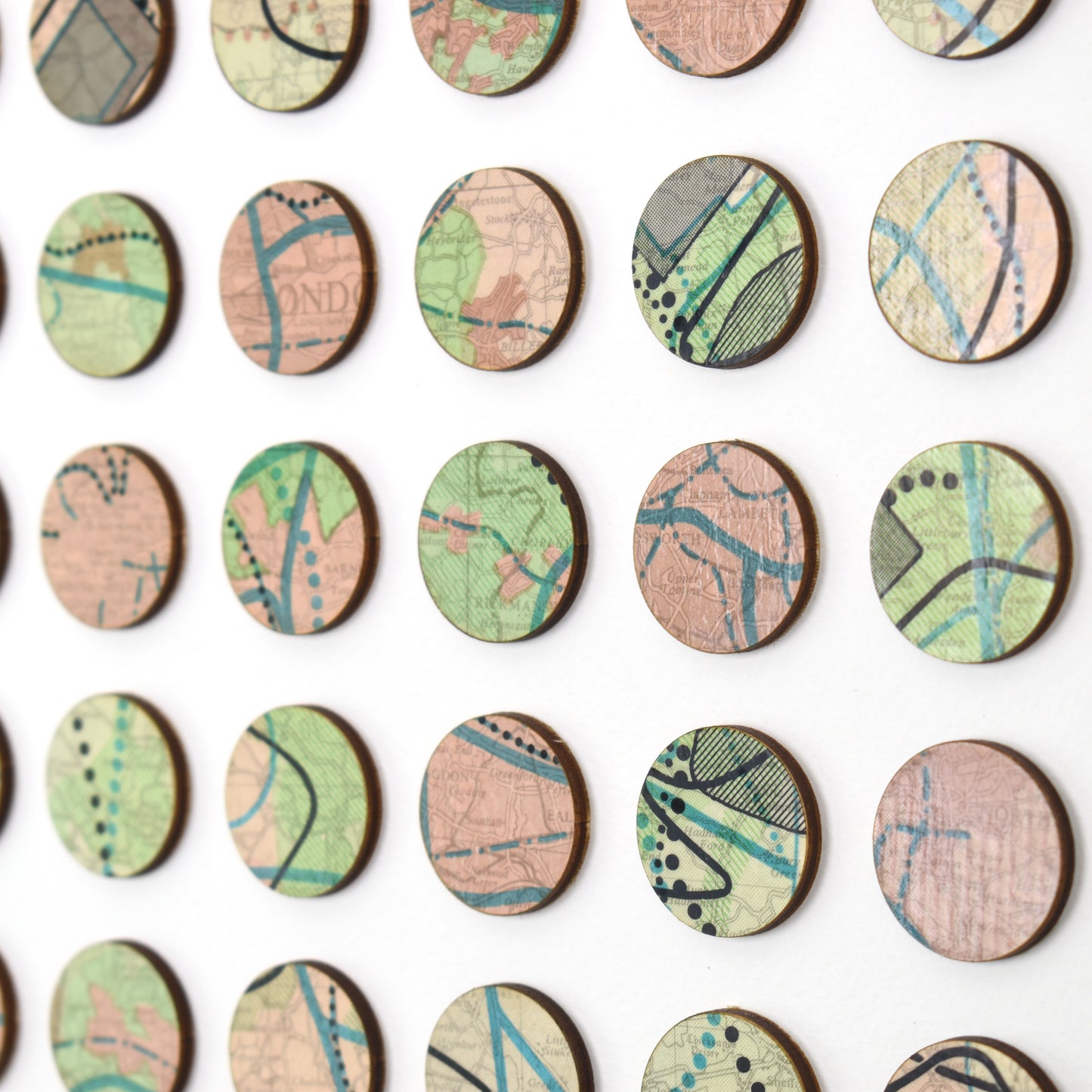 One Hundred London Infrastructure Pink and Green Map Dots Collage