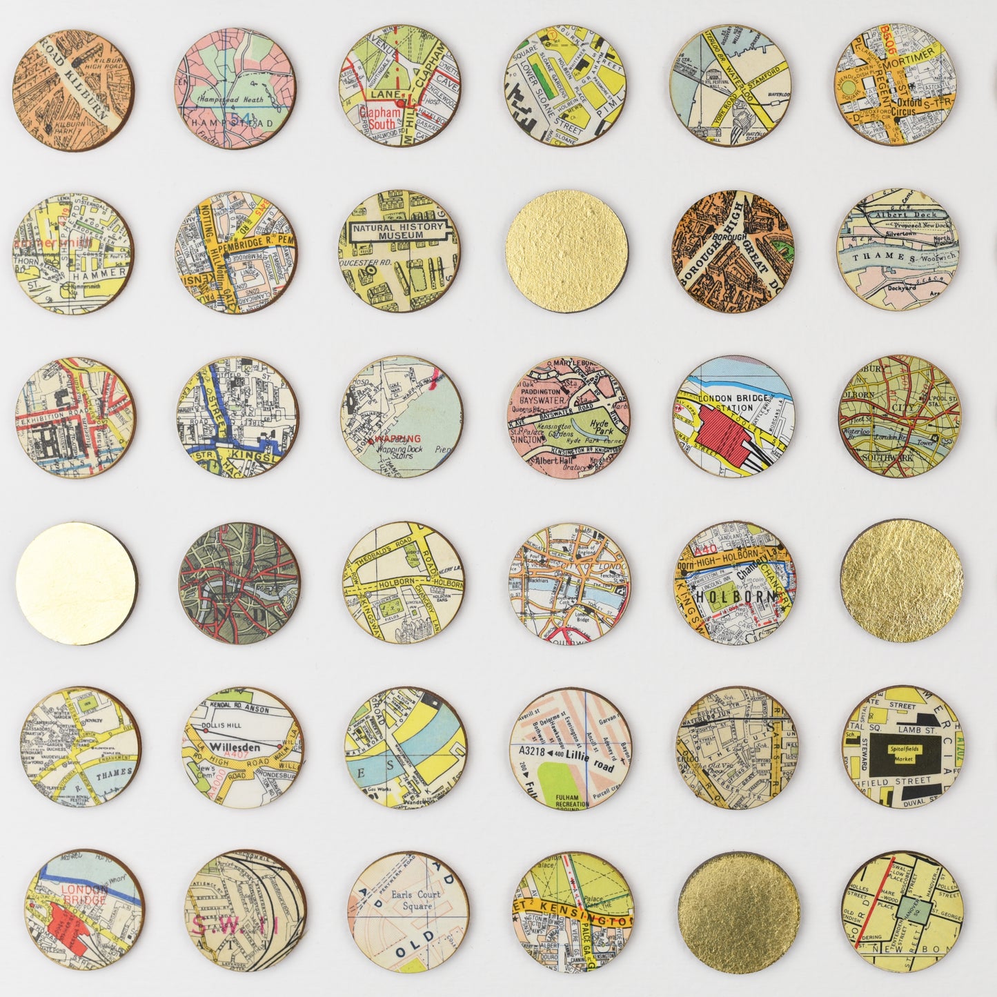 Close up of London map dots with gold leaf by Amelia Coward