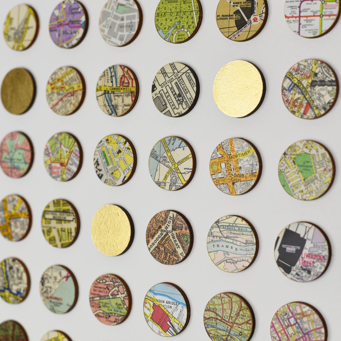 Detail of London map dots with gold leaf by Amelia Coward