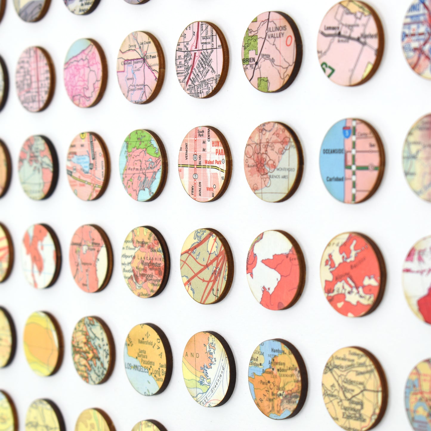 Angle image of Amelia Coward's map dots wall art, red and pink