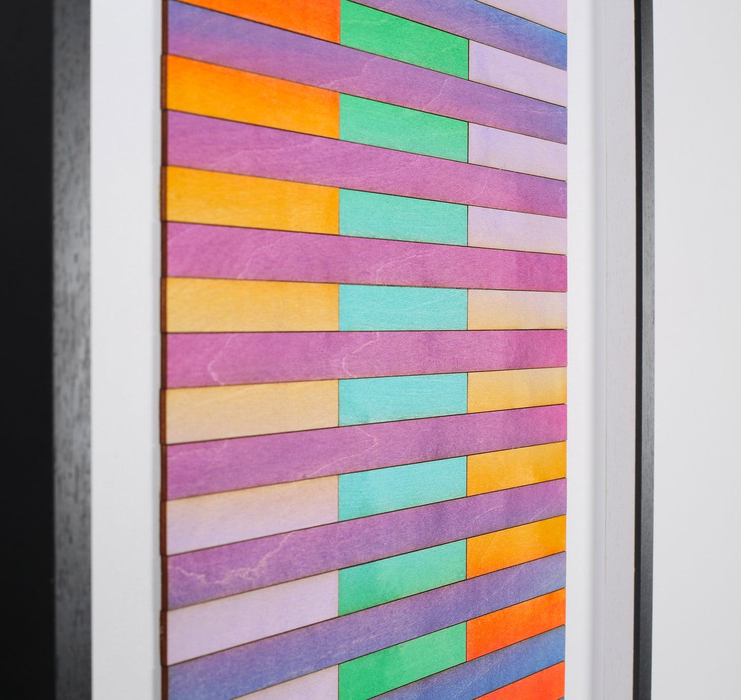 Detail of colour study by Amelia Coward, featuring horizontal stripes in blue, green, pink, and yellow tones