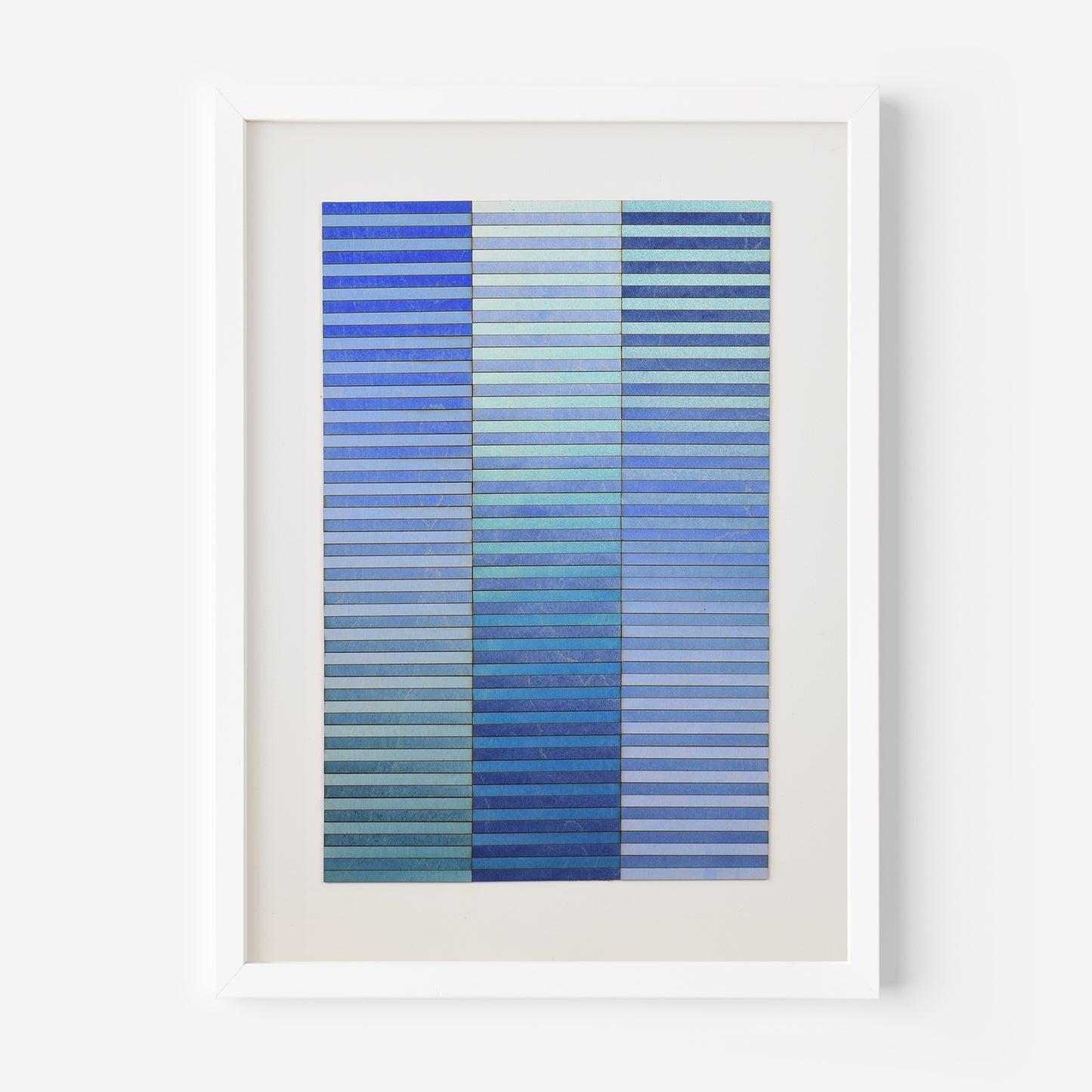 Blue abstract artwork by Amelia Coward, 3d horizontal stripes cut from birchwood panel paintings